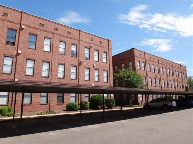 730 Litty Court, Unit 101 Memphis, TN 38103 - Photo 1 of 22 a city view of a building from a balcony