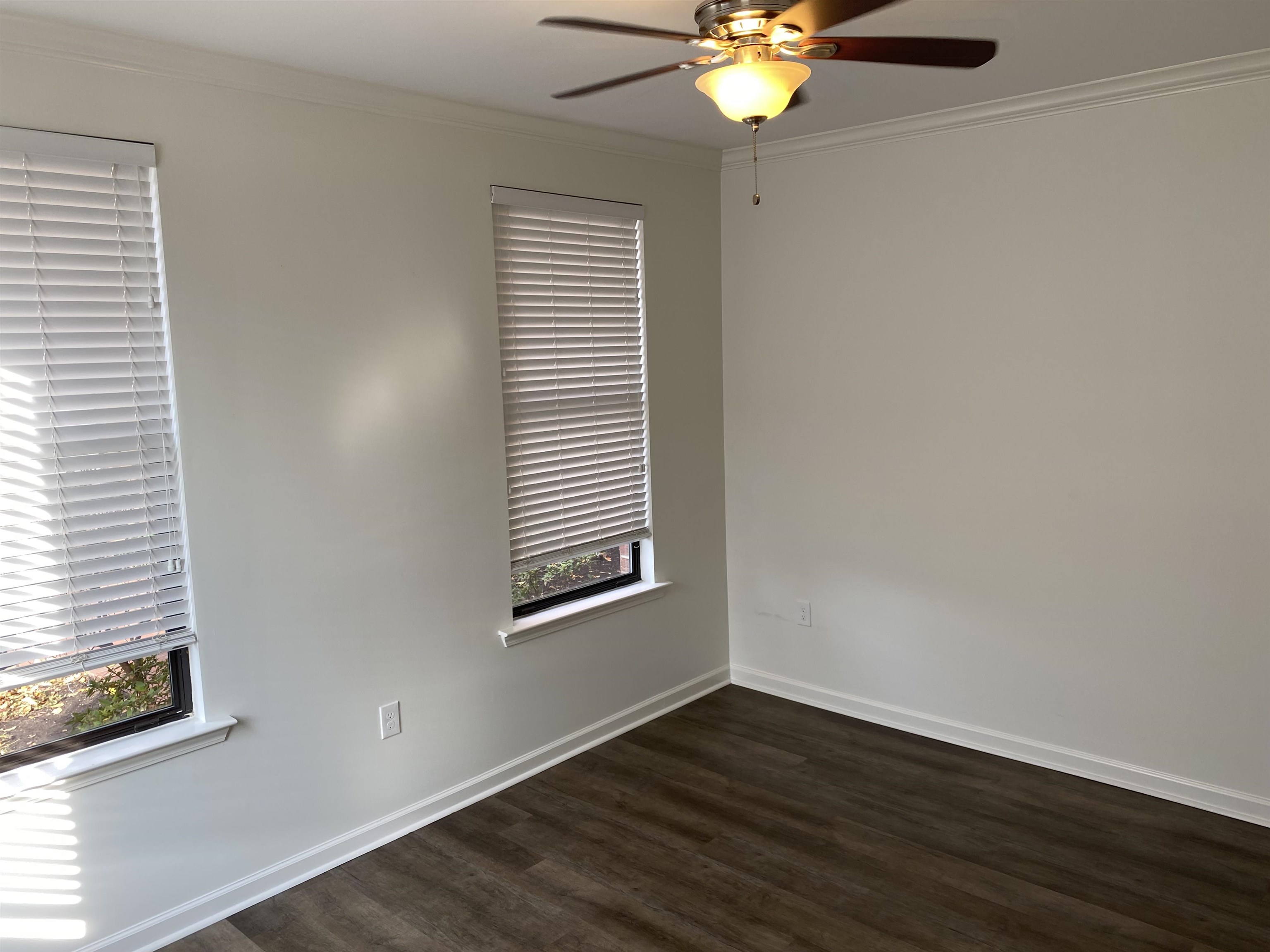 730 Litty Court, Unit 101 Memphis, TN 38103 - Photo 13 of 22 a view of an empty room with wooden floor and a window