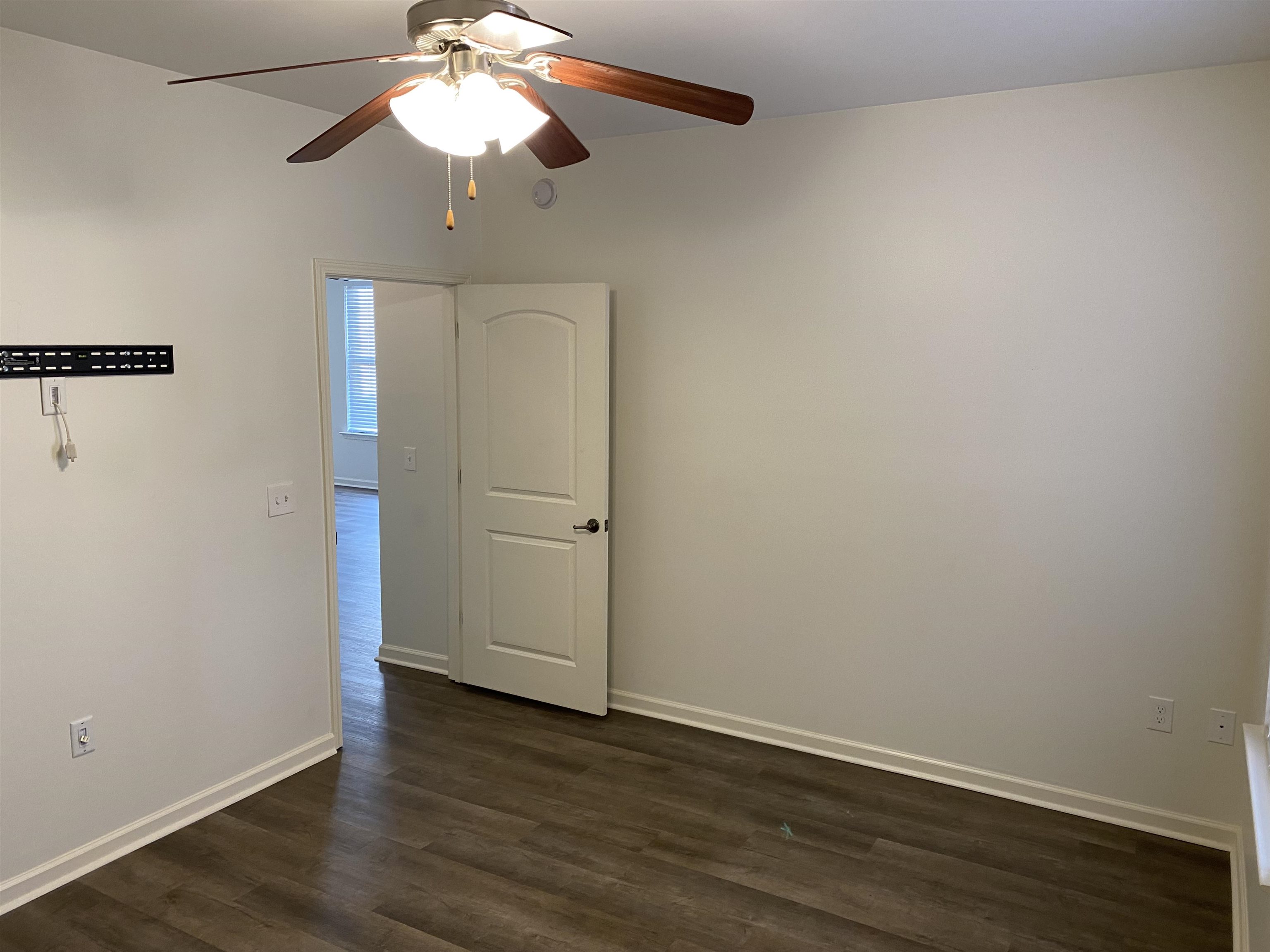 730 Litty Court, Unit 101 Memphis, TN 38103 - Photo 18 of 22 a view of an empty room with wooden floor