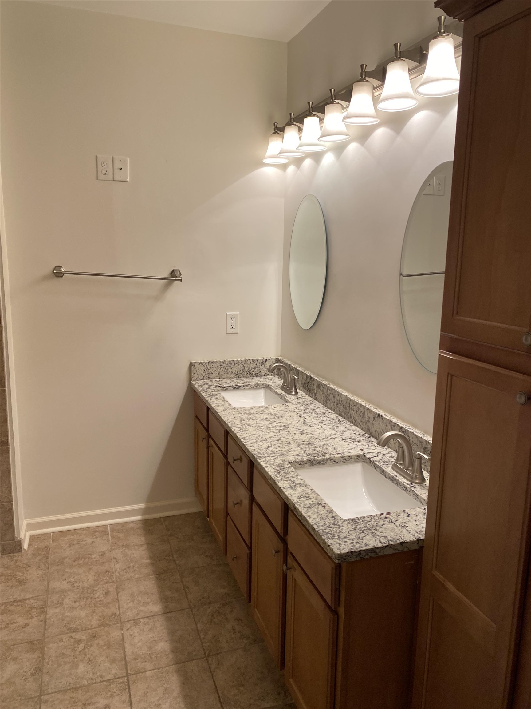 730 Litty Court, Unit 101 Memphis, TN 38103 - Photo 21 of 22 a bathroom with a granite countertop sink and a mirror