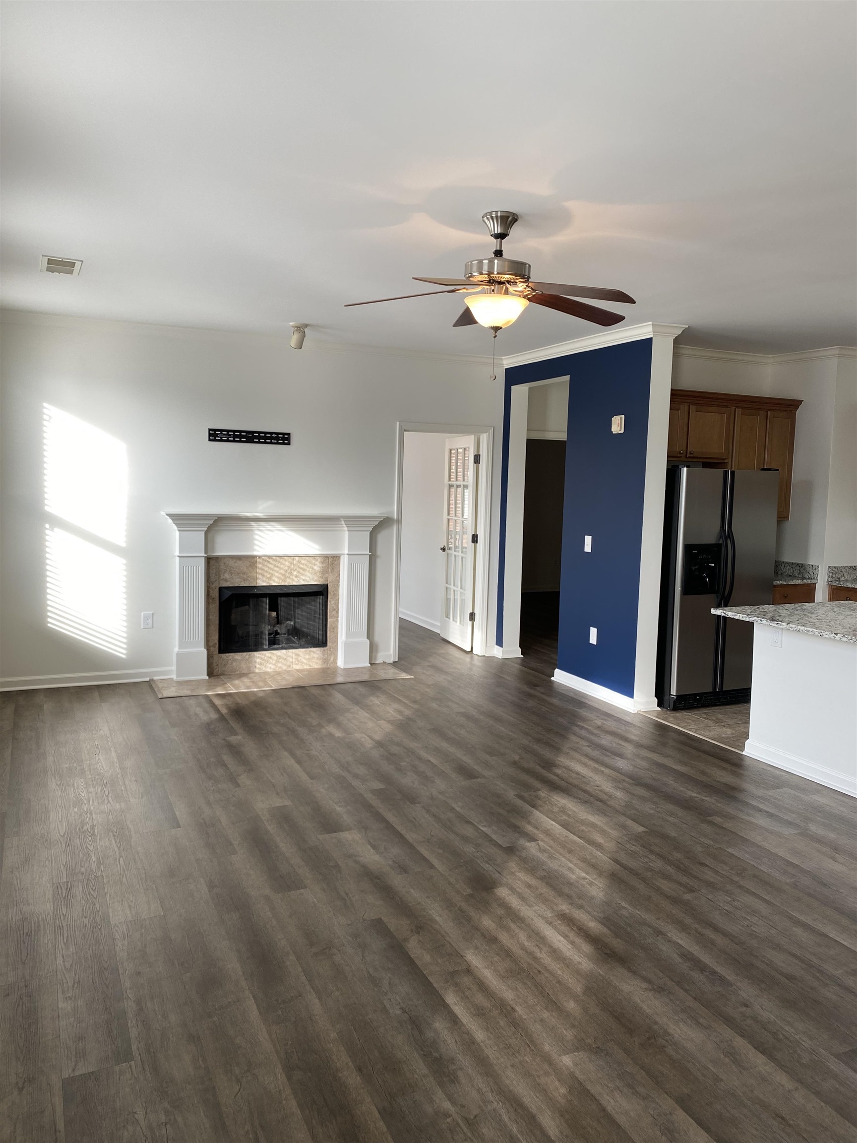 730 Litty Court, Unit 101 Memphis, TN 38103 - Photo 4 of 22 a view of empty room with a fireplace and wooden floor