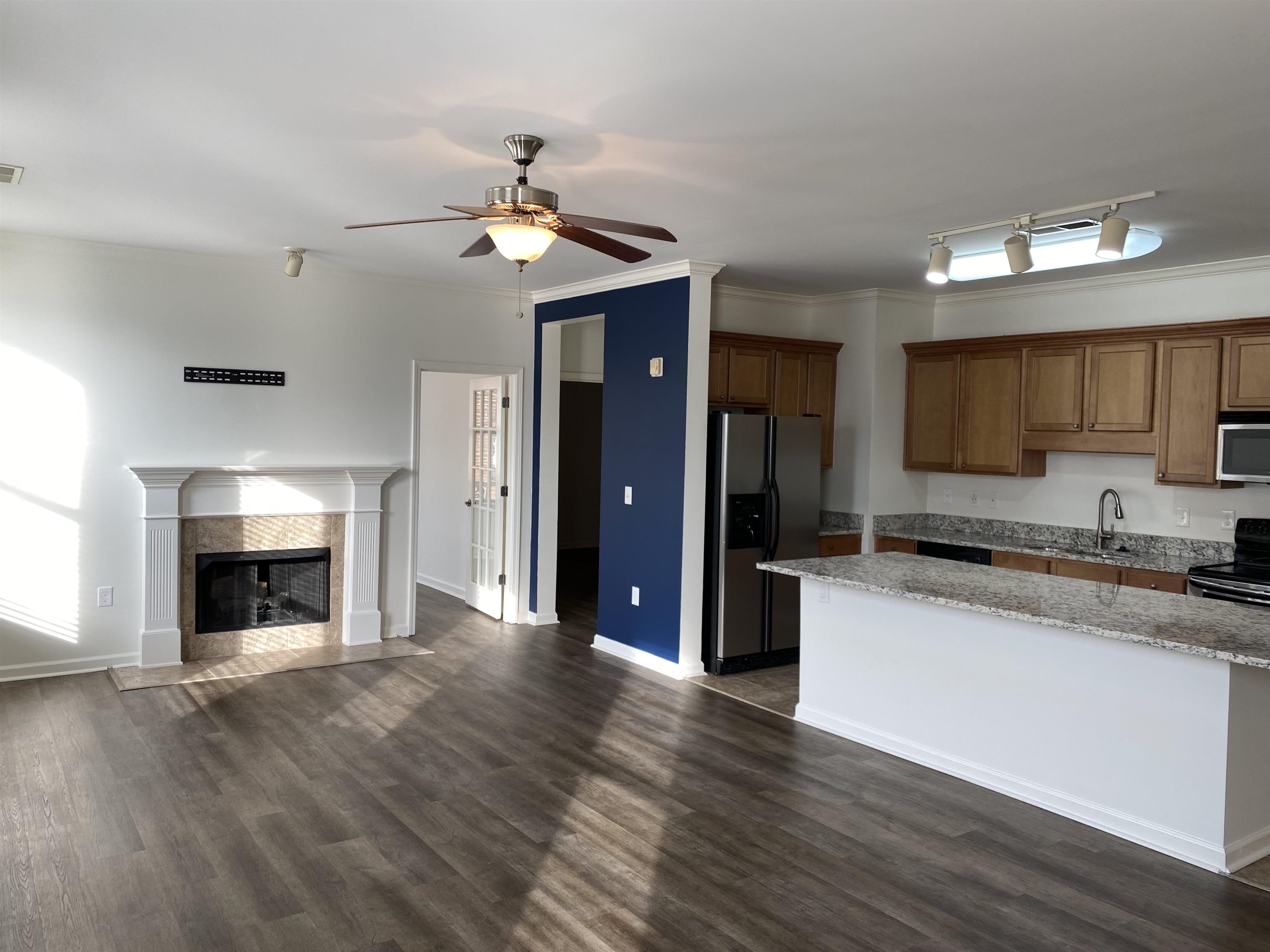 730 Litty Court, Unit 101 Memphis, TN 38103 - Photo 6 of 22 a large kitchen with granite countertop a stove top oven a sink and dishwasher
