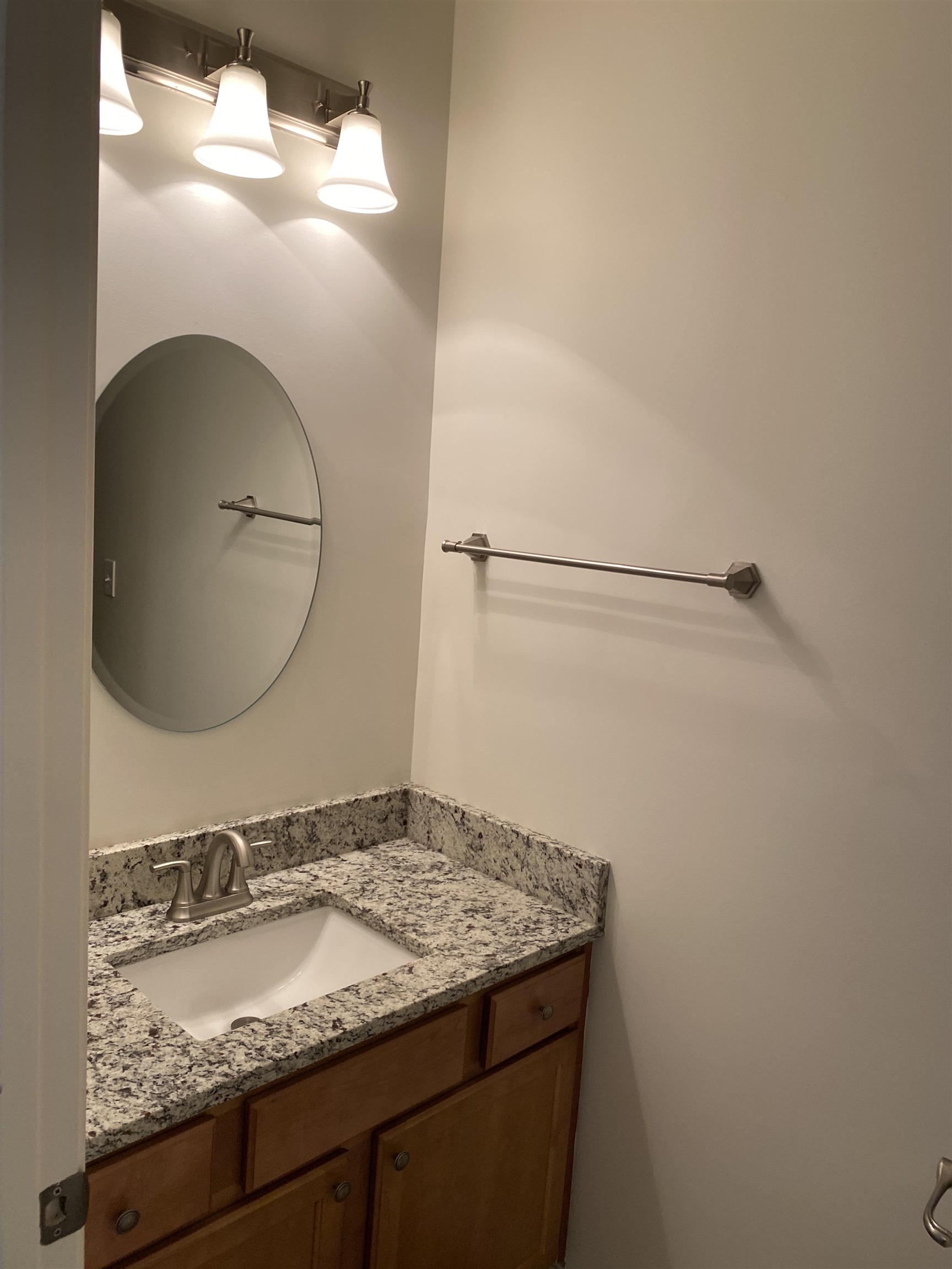 730 Litty Court, Unit 101 Memphis, TN 38103 - Photo 8 of 22 a bathroom with a granite countertop sink and mirror