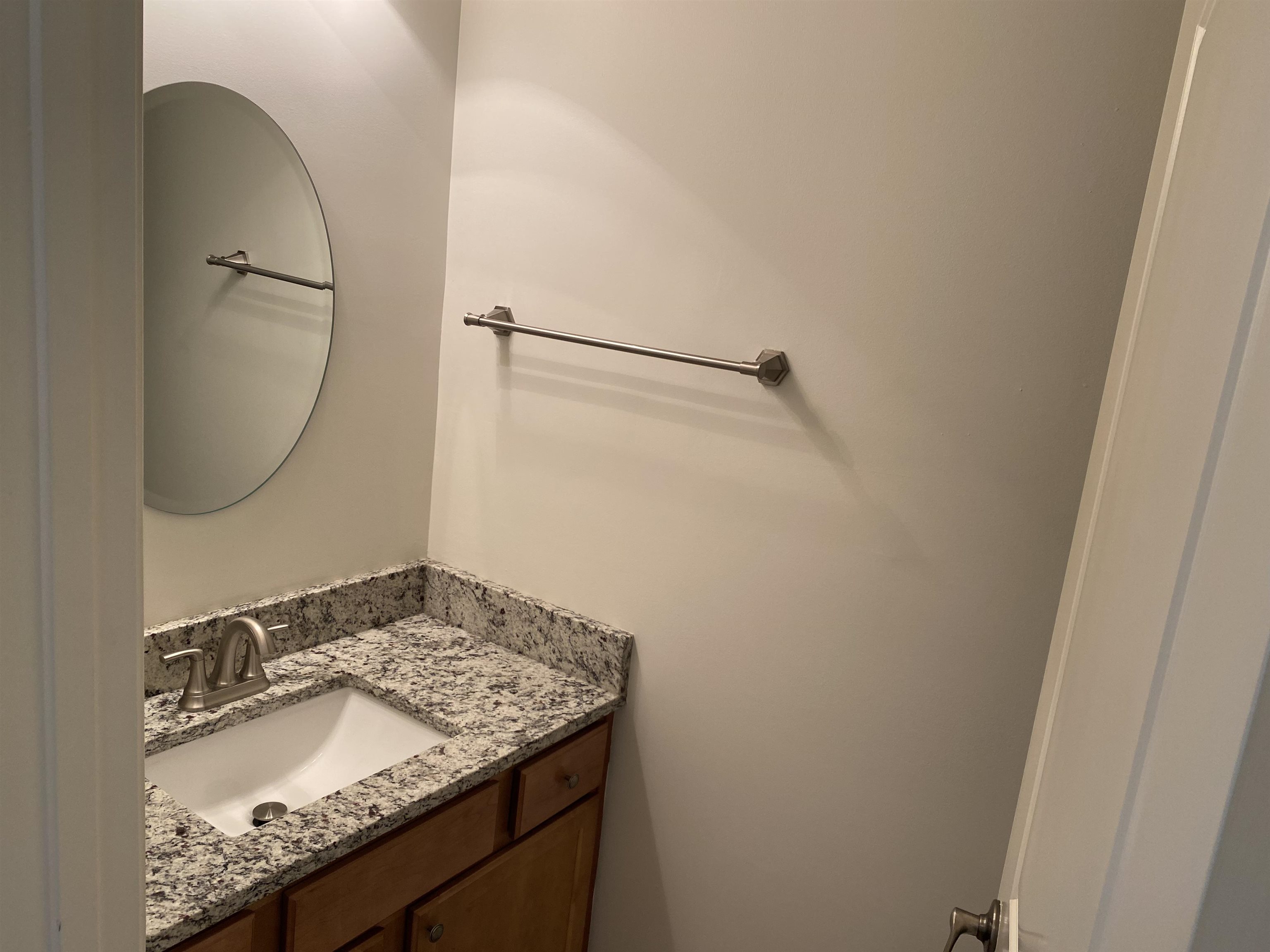 730 Litty Court, Unit 101 Memphis, TN 38103 - Photo 9 of 22 a bathroom with a granite countertop sink and a mirror