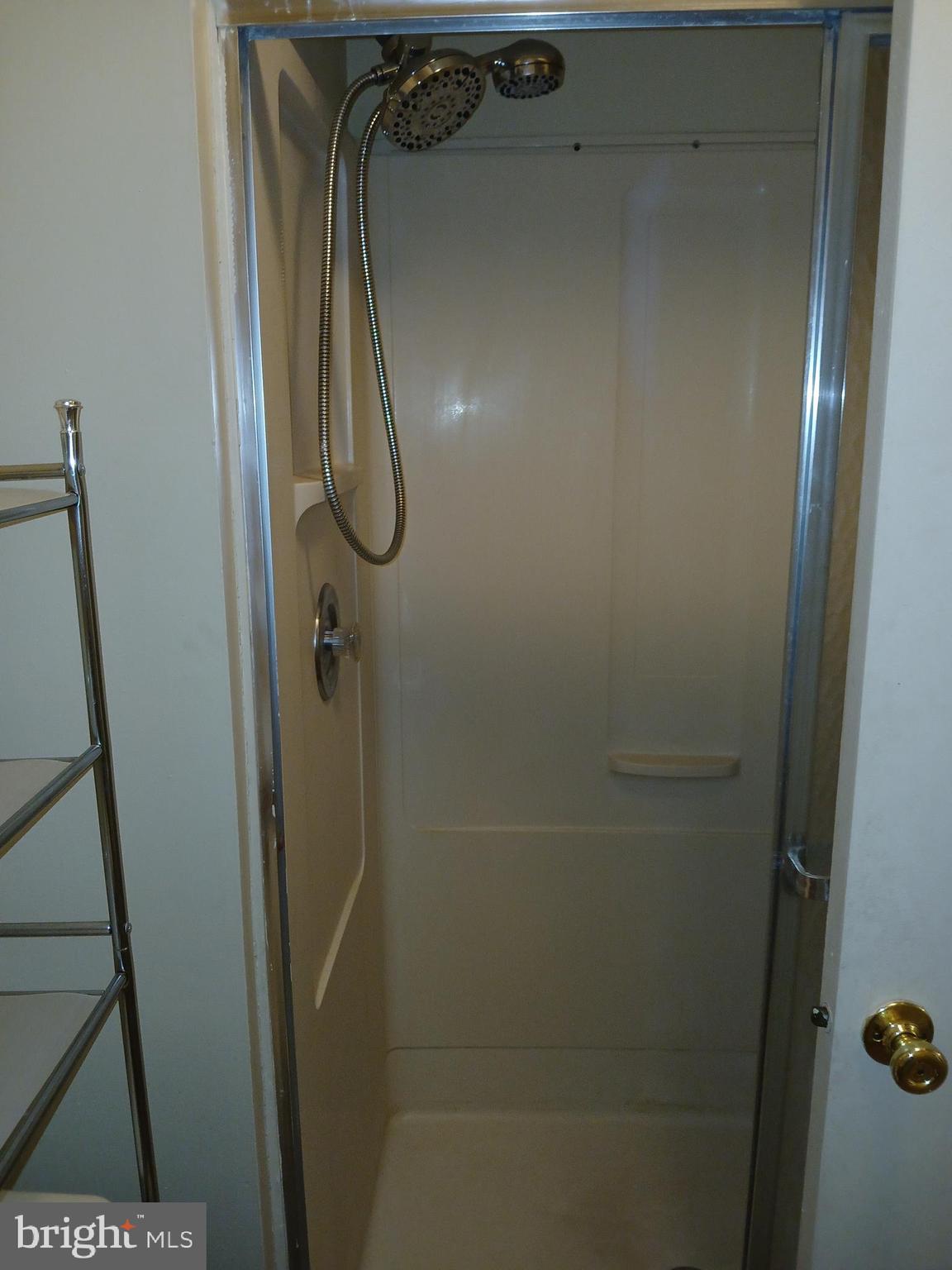 1803 Huntingdon Mews Clementon, NJ 08021 - Photo 7 of 9 a bathroom with a glass shower door