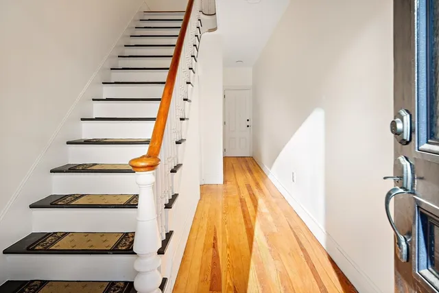 a view of entryway with wooden floor
