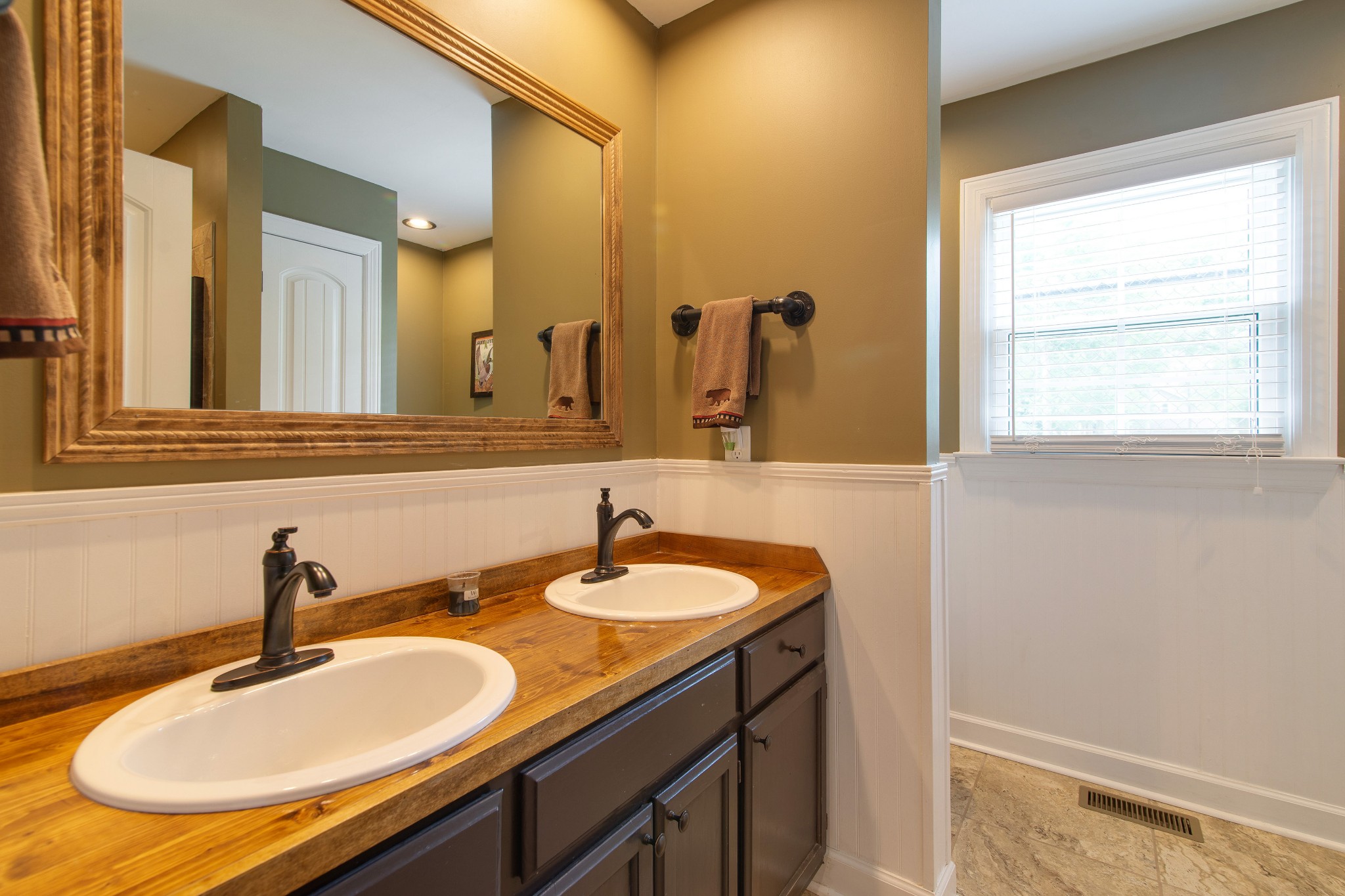 6249 Ladd Road Franklin, TN 37067 - Photo 29 of 50 a bathroom with a sink and a mirror