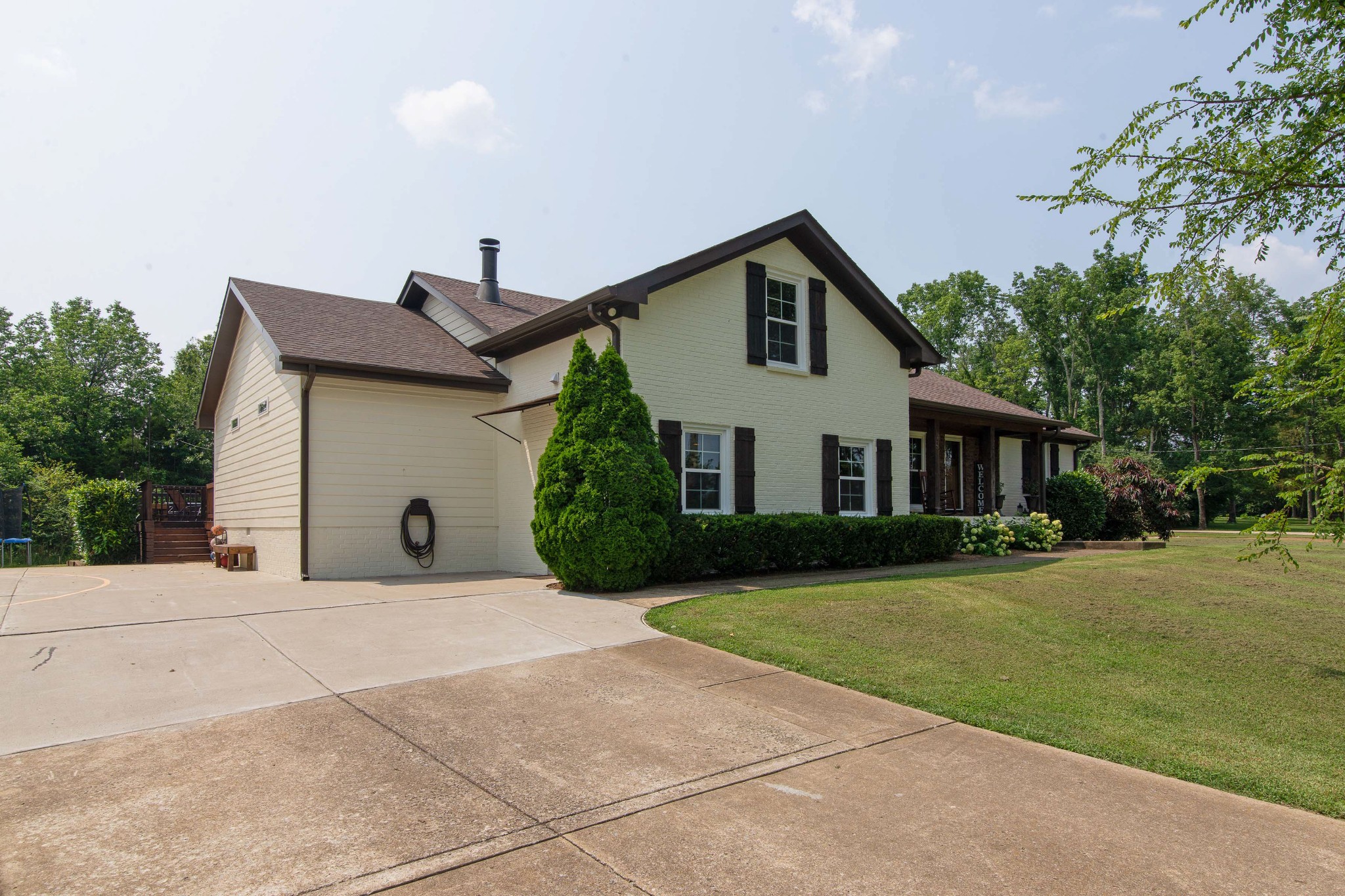 6249 Ladd Road Franklin, TN 37067 - Photo 4 of 50 a view of a house with a yard and plants