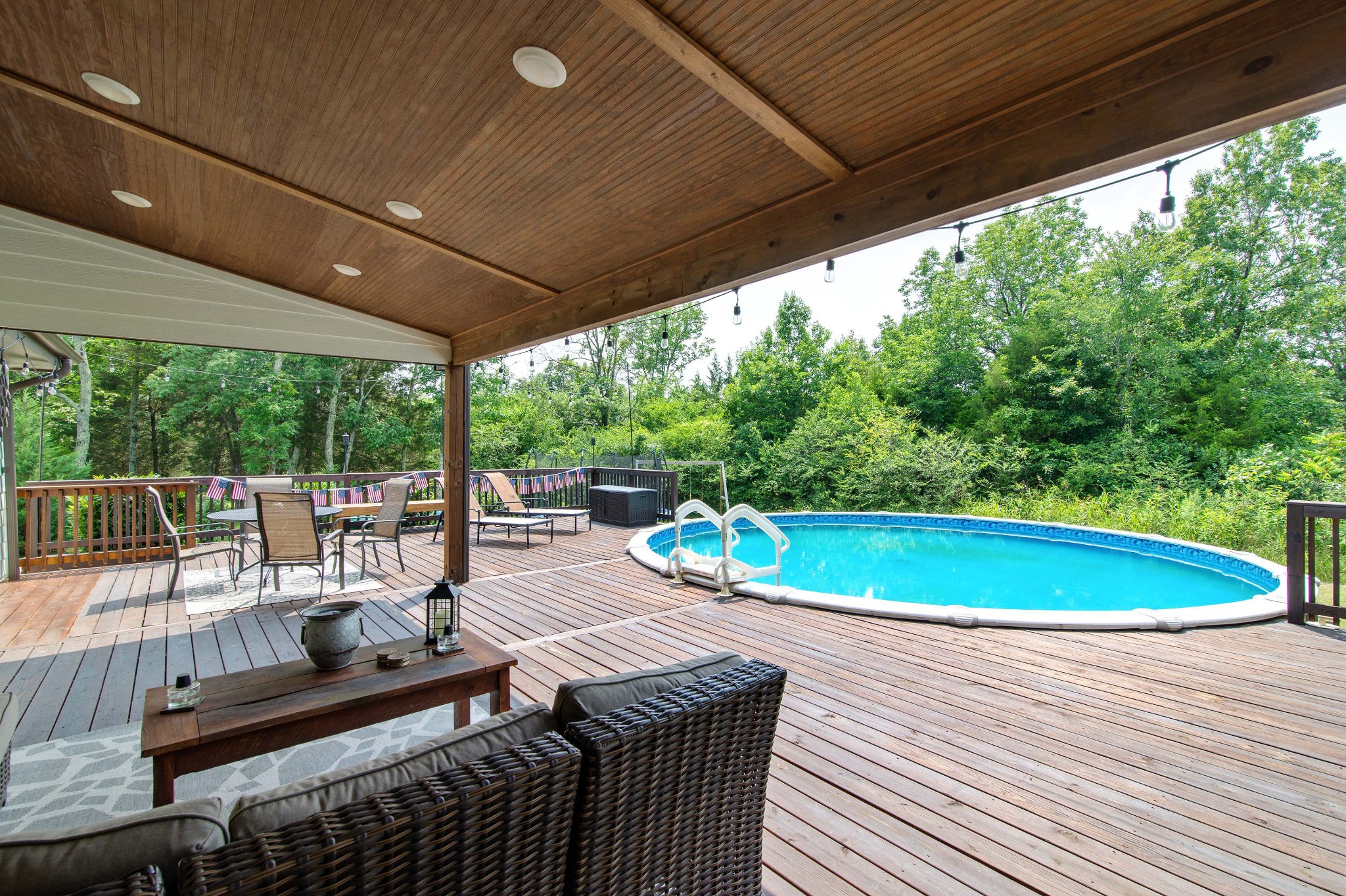 6249 Ladd Road Franklin, TN 37067 - Photo 39 of 50 a view of a patio with a dining table and chairs with wooden floor