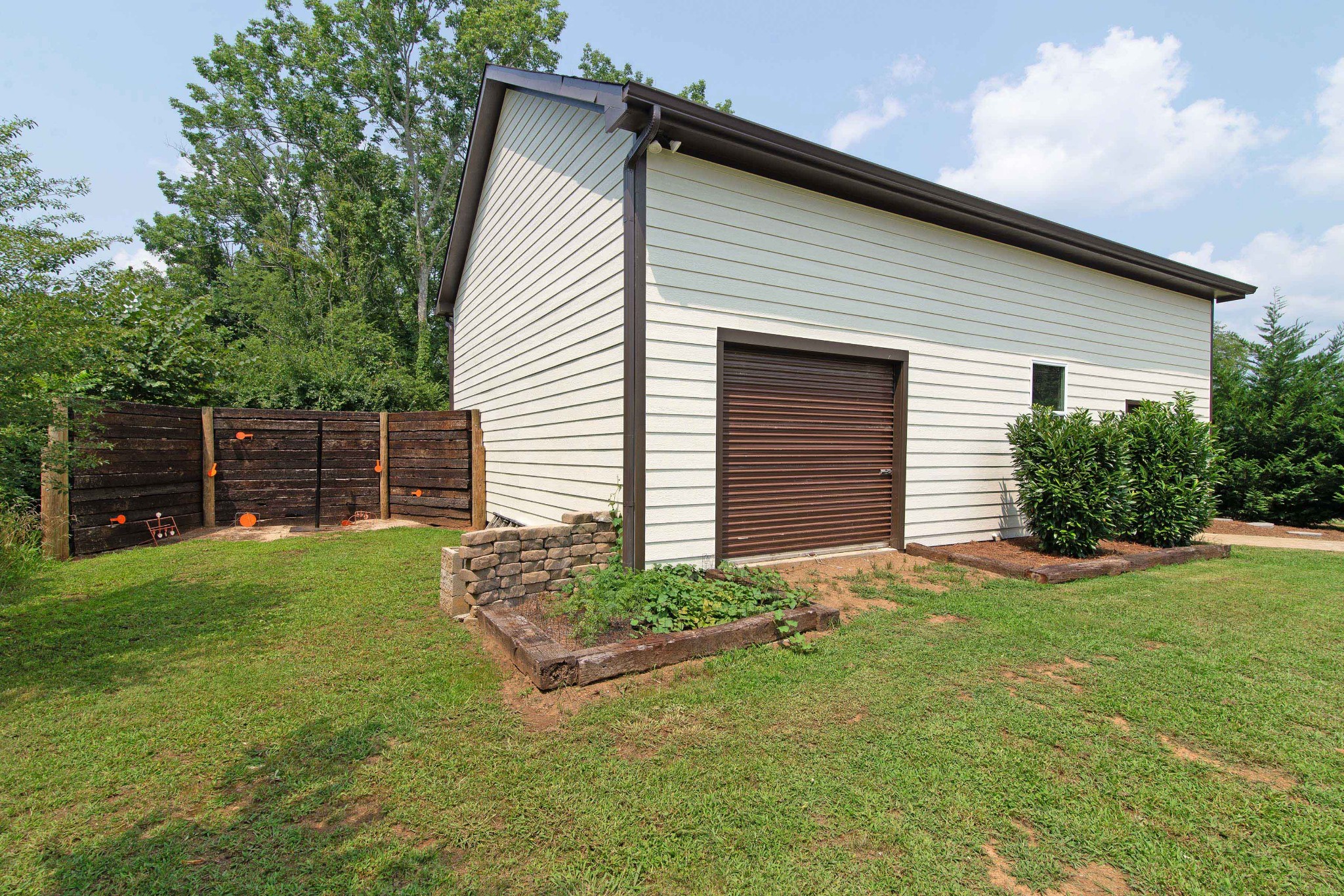 6249 Ladd Road Franklin, TN 37067 - Photo 46 of 50 a view of a backyard with plants and a barbeque