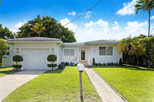a view of a backyard with a sitting area