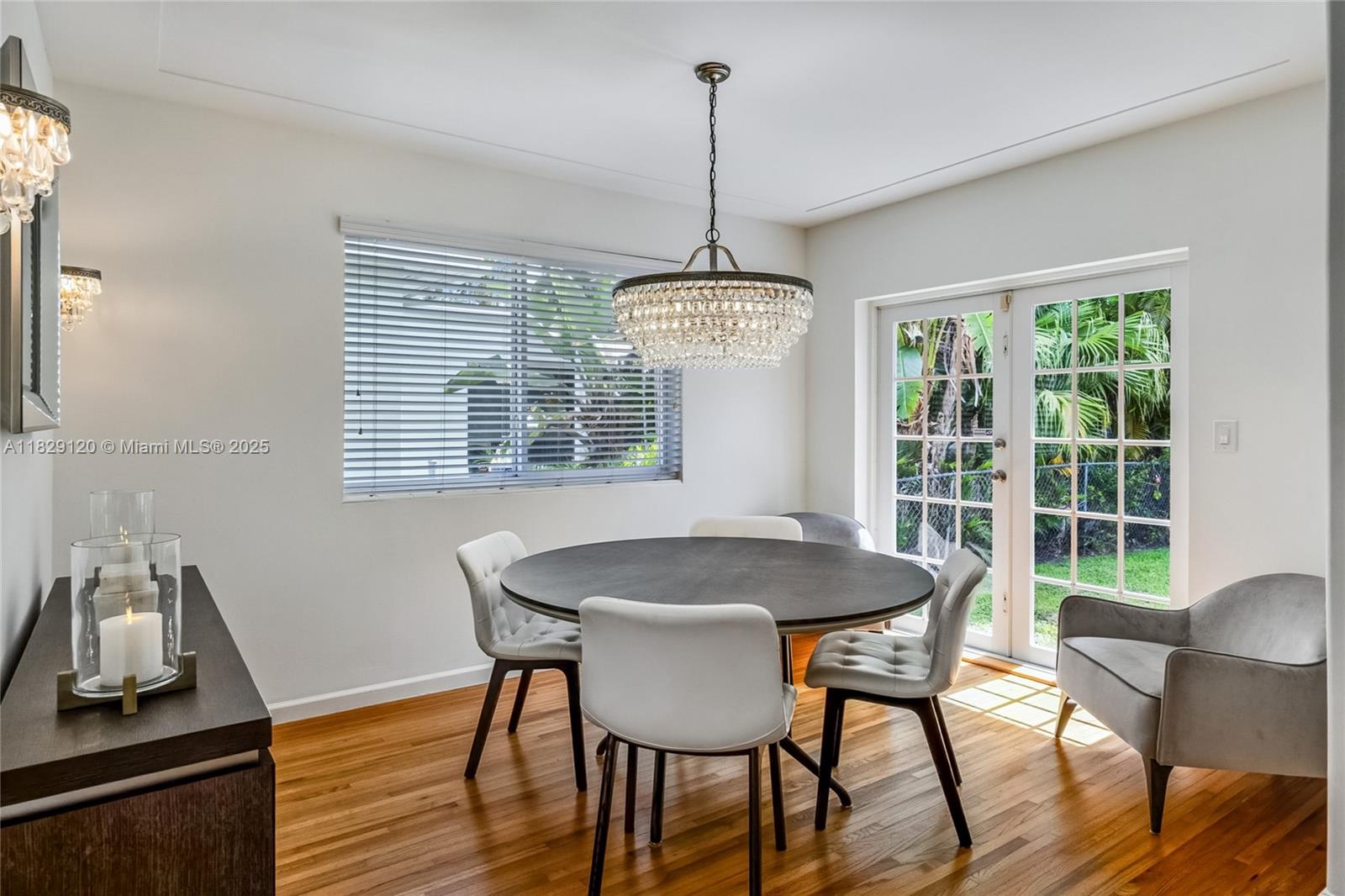 8811 Hawthorne Avenue Surfside, FL 33154 - Photo 12 of 47 a view of a dining room with furniture window and outside view
