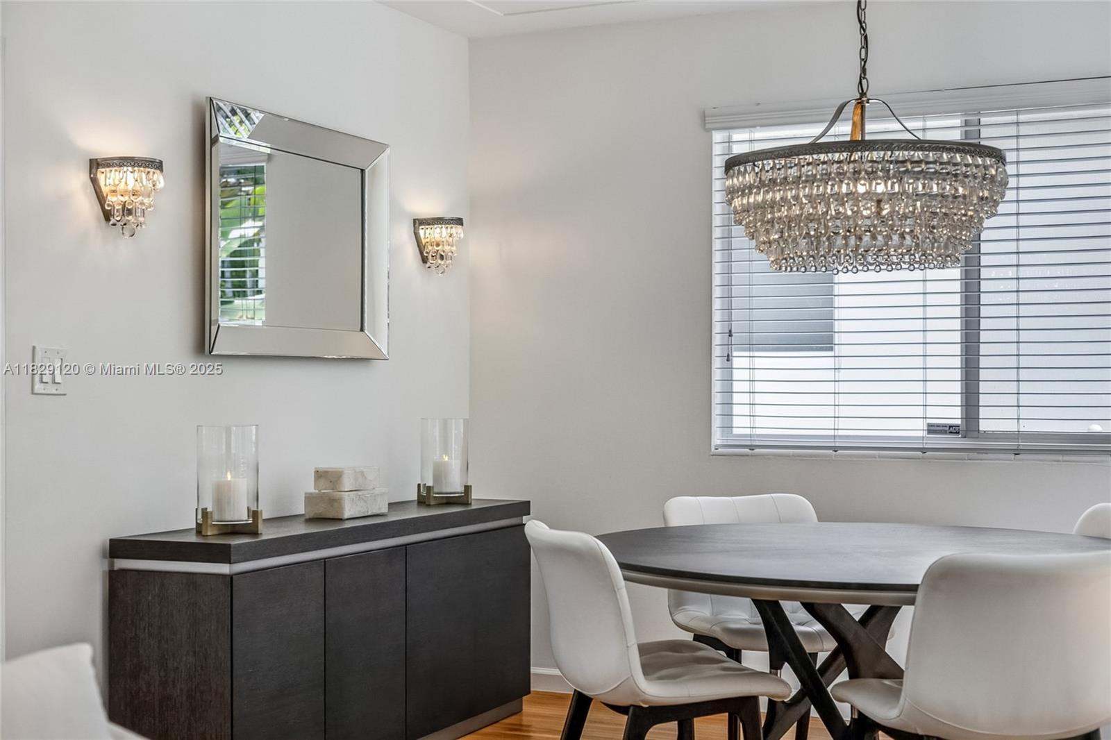 8811 Hawthorne Avenue Surfside, FL 33154 - Photo 13 of 47 a view of a dining room with furniture and window