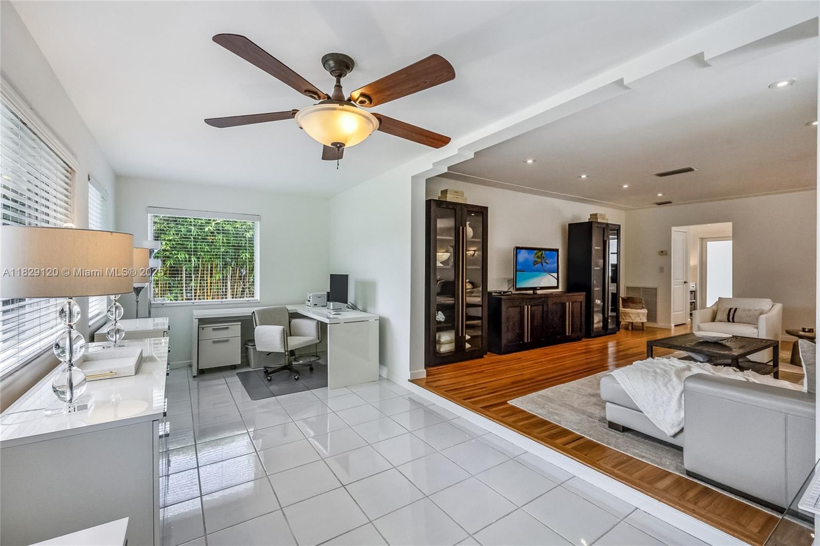 8811 Hawthorne Avenue Surfside, FL 33154 - Photo 14 of 47 a living room with furniture and a large window