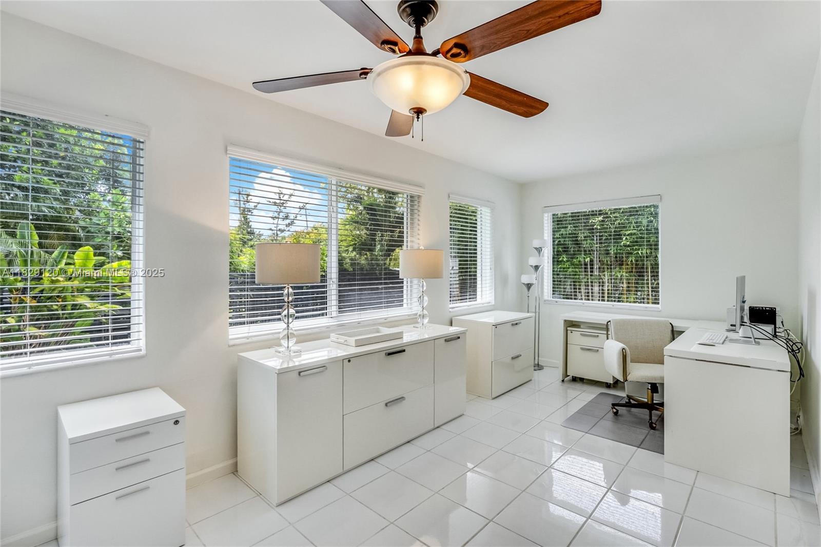 8811 Hawthorne Avenue Surfside, FL 33154 - Photo 16 of 47 a kitchen that has a sink and a stove in it