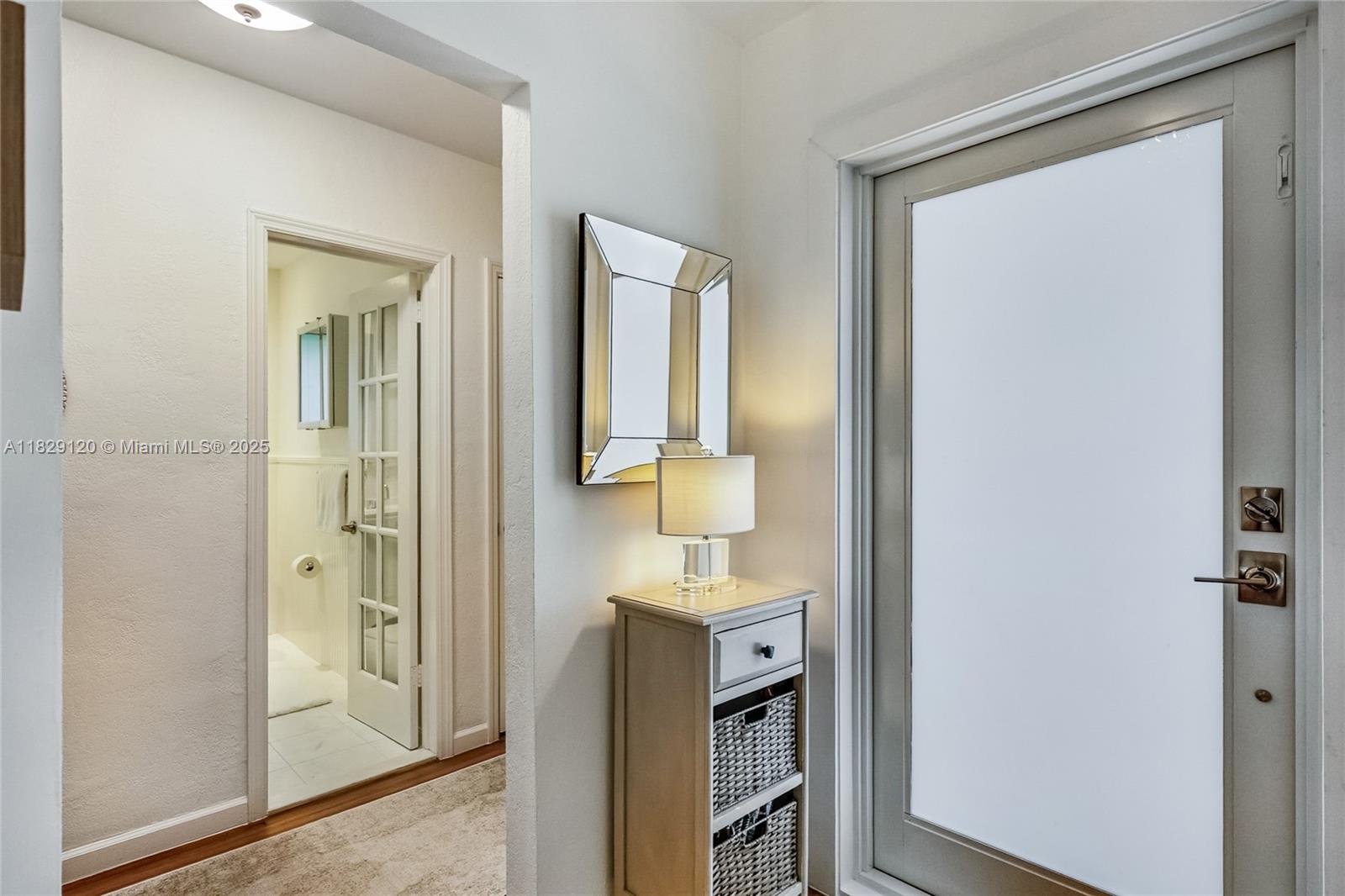 8811 Hawthorne Avenue Surfside, FL 33154 - Photo 25 of 47 a bathroom with a sink a mirror and shower