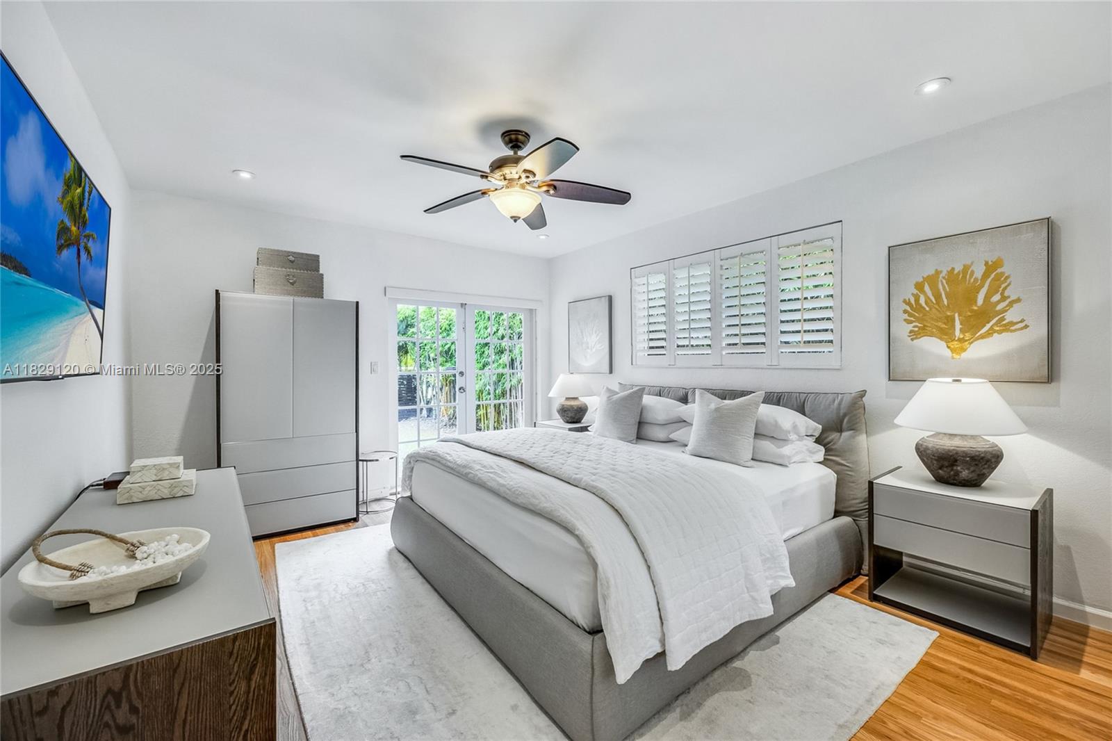 8811 Hawthorne Avenue Surfside, FL 33154 - Photo 26 of 47 a bedroom with a bed and a window