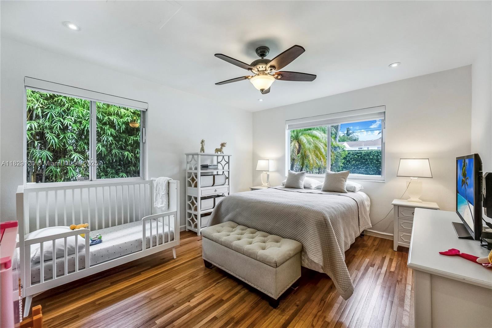 8811 Hawthorne Avenue Surfside, FL 33154 - Photo 30 of 47 a bedroom with a bed and a couch