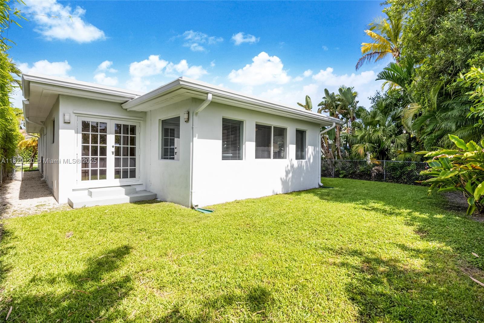 8811 Hawthorne Avenue Surfside, FL 33154 - Photo 3 of 47 a view of a house with backyard and garden
