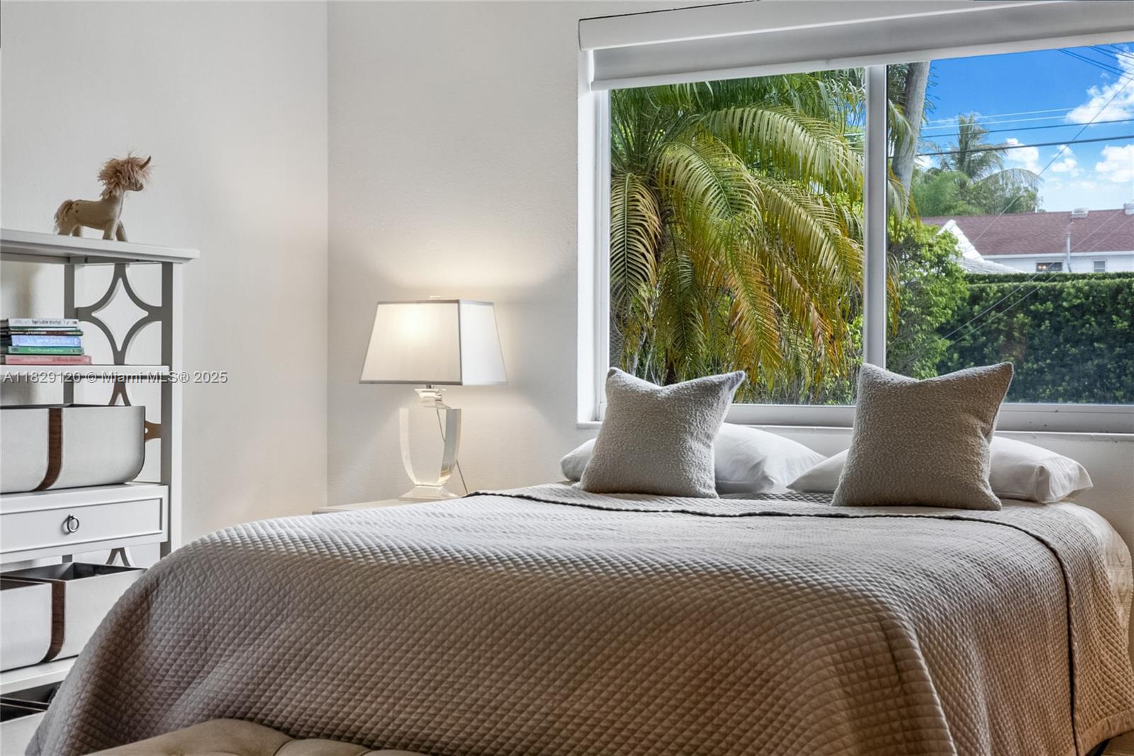 8811 Hawthorne Avenue Surfside, FL 33154 - Photo 31 of 47 a bedroom with a large bed and a window