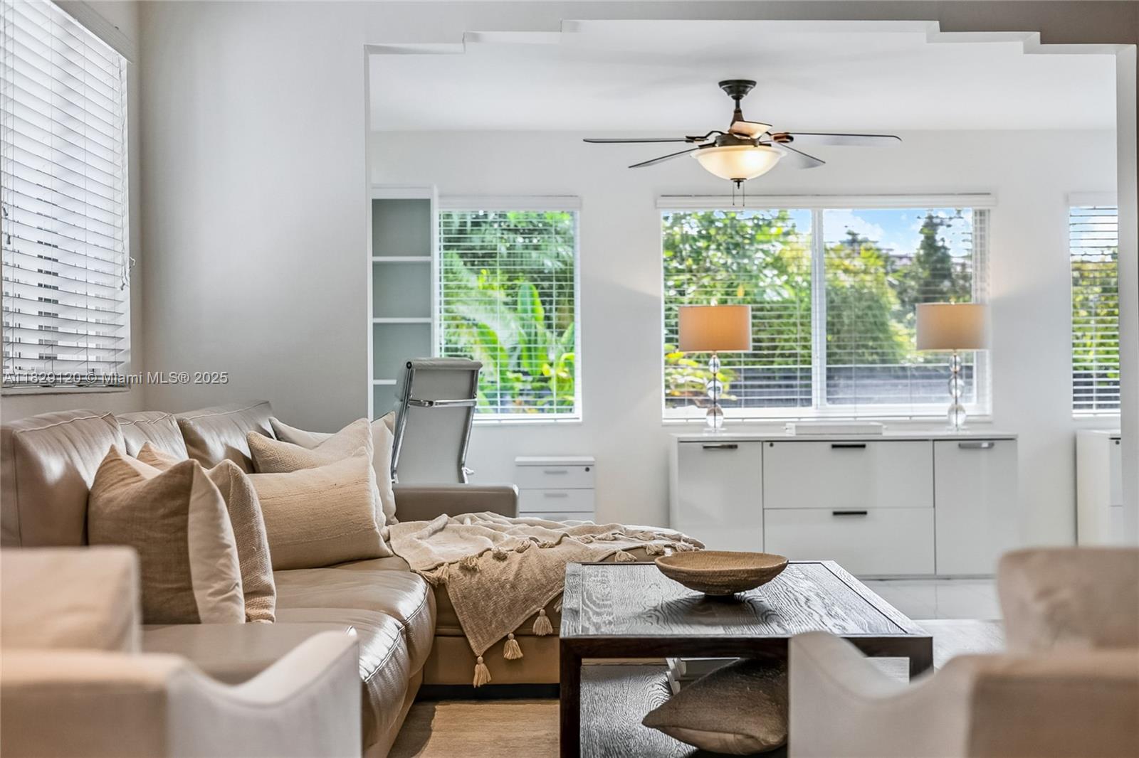 8811 Hawthorne Avenue Surfside, FL 33154 - Photo 34 of 47 a living room with furniture and a window