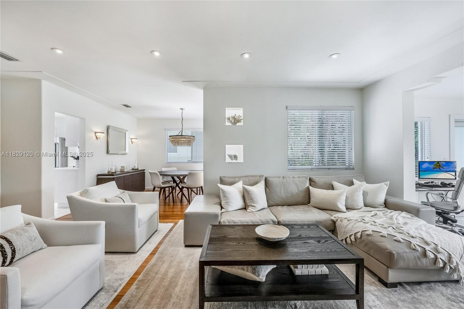 8811 Hawthorne Avenue Surfside, FL 33154 - Photo 7 of 47 a living room with furniture and a table