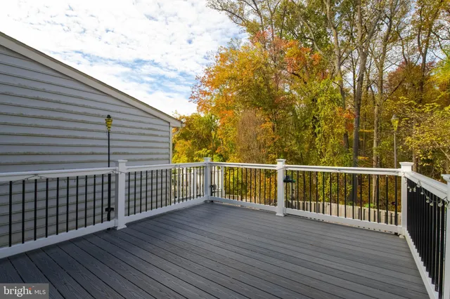a view of a balcony with wooden floor