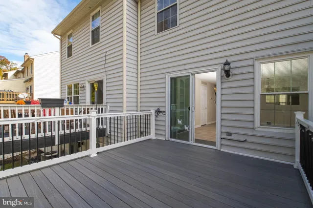 a view of a house with wooden deck