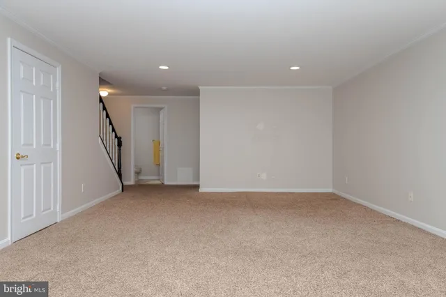 a view of an empty room with stairs