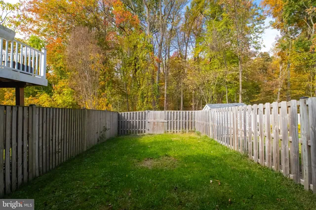 a view of a wooden fence