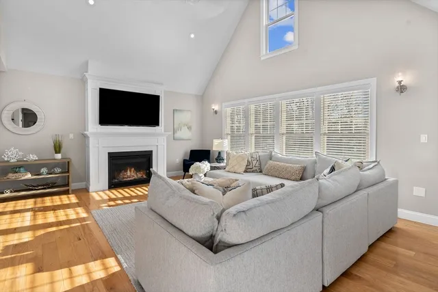 a spacious bedroom with a bed and a flat screen tv