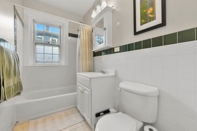 a bathroom with a toilet and a bathtub