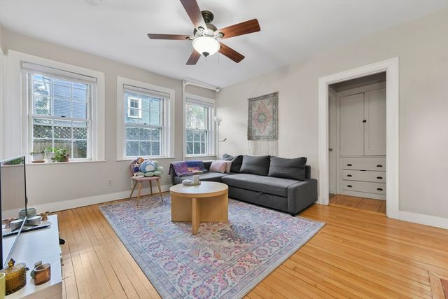 a living room with furniture and a rug