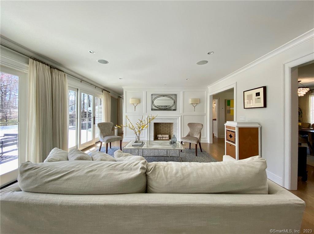 7 Whaling Road Darien, CT 06820 - Photo 4 of 34 a living room with fireplace furniture and a large window