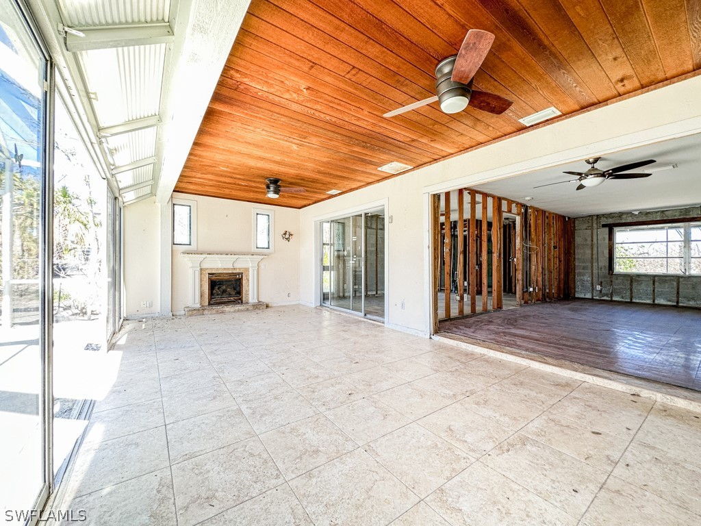 671 Rabbit Road Sanibel, FL 33957 - Photo 19 of 50 a view of livingroom with furniture and windows