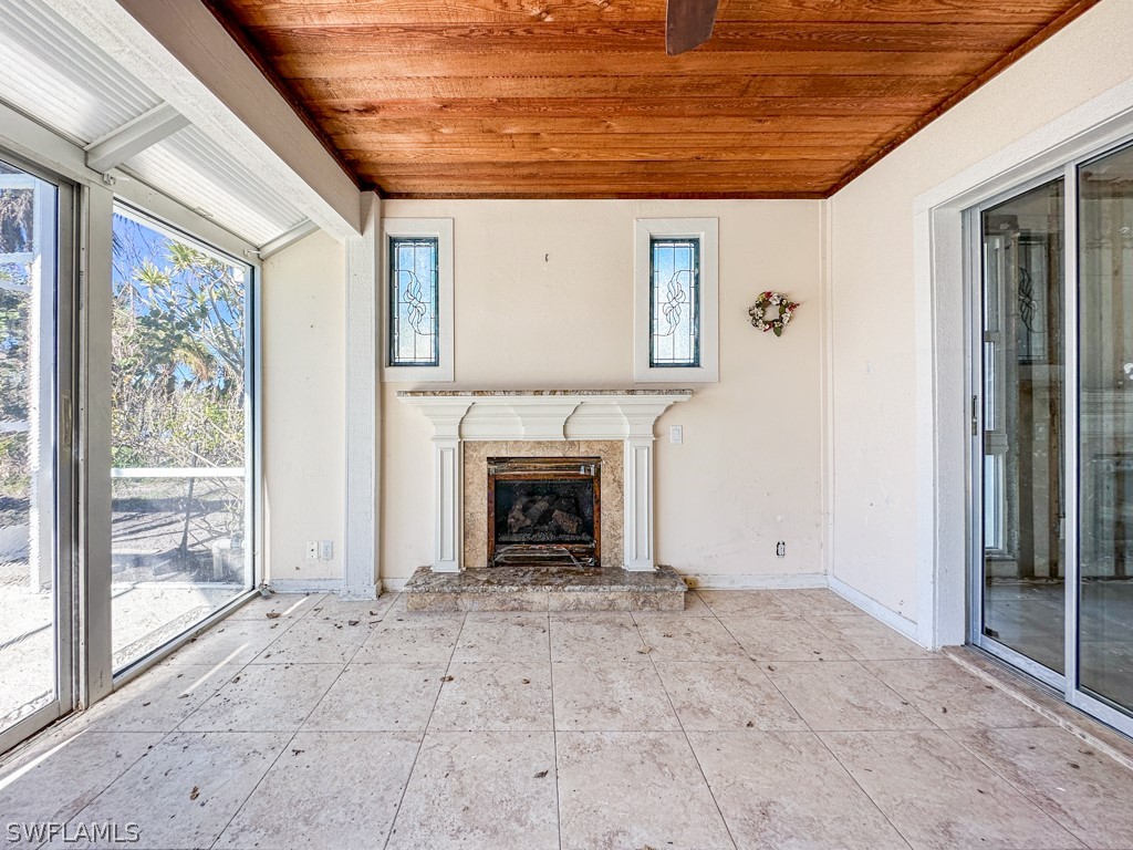 671 Rabbit Road Sanibel, FL 33957 - Photo 20 of 50 a view of a livingroom with a fireplace and window