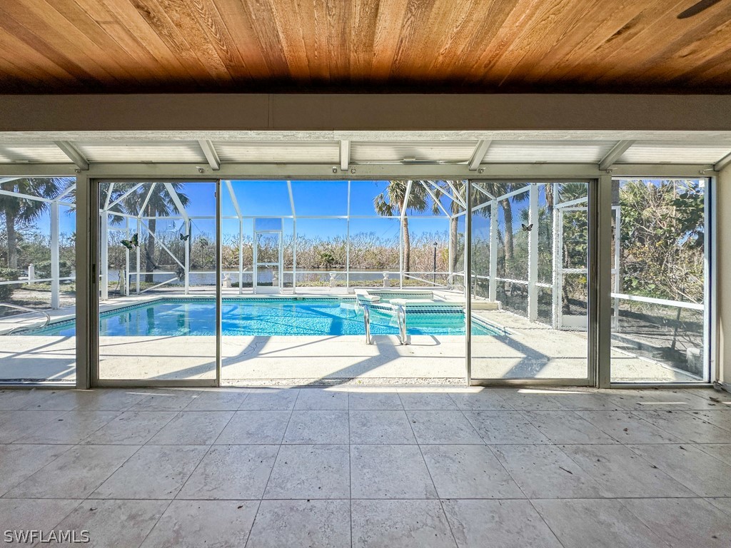 671 Rabbit Road Sanibel, FL 33957 - Photo 22 of 50 a view of an empty room with wooden floor