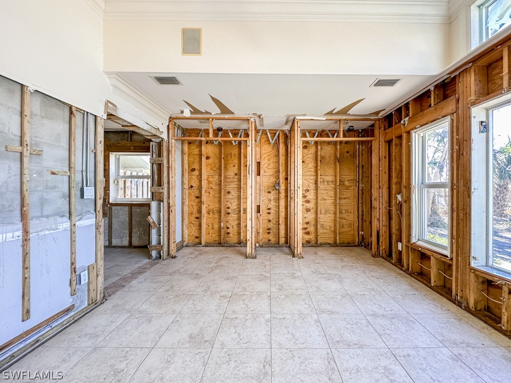 671 Rabbit Road Sanibel, FL 33957 - Photo 25 of 50 a view of an empty room with a window