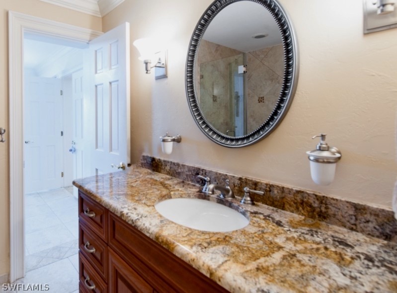 671 Rabbit Road Sanibel, FL 33957 - Photo 28 of 50 a bathroom with a sink and a mirror