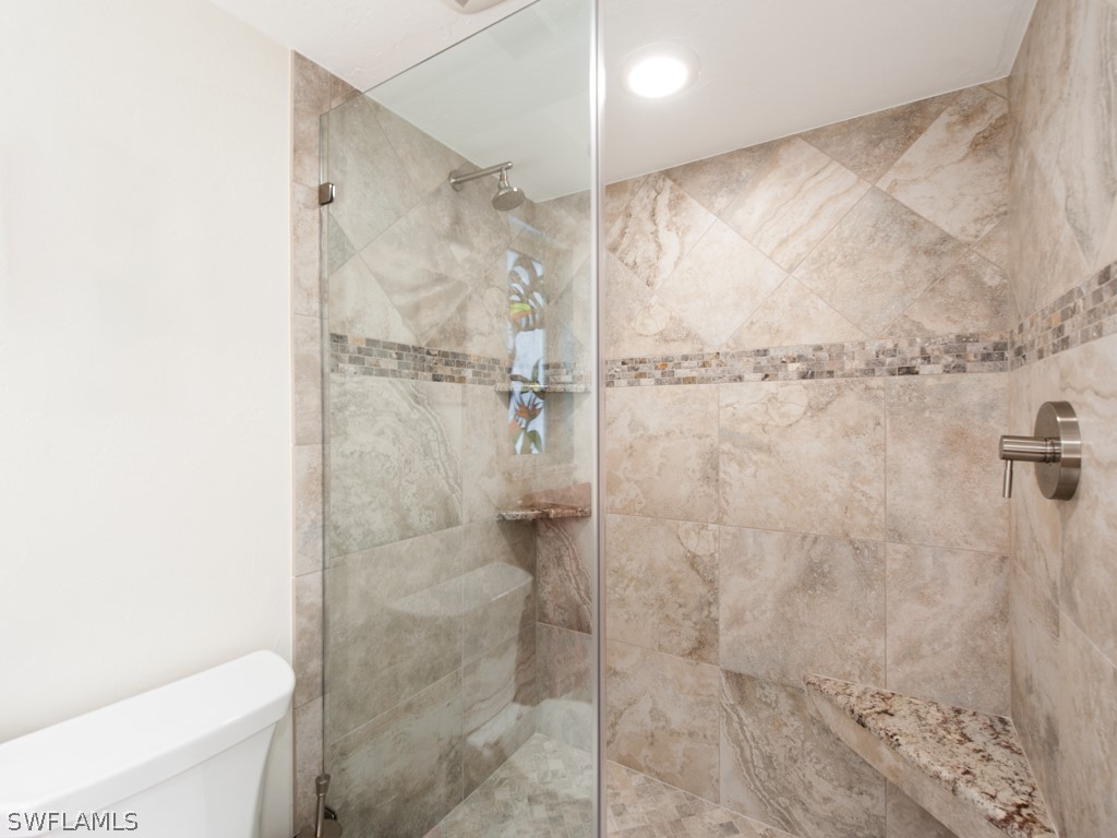 671 Rabbit Road Sanibel, FL 33957 - Photo 32 of 50 a bathroom with a shower and a toilet