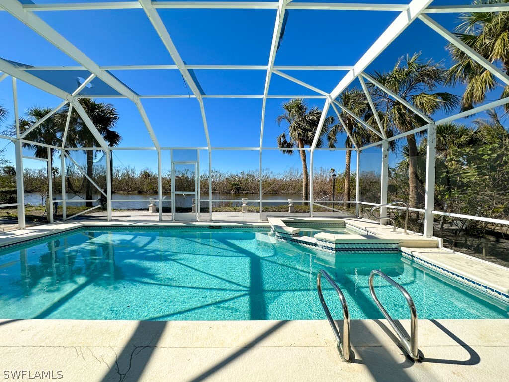 671 Rabbit Road Sanibel, FL 33957 - Photo 37 of 50 a view of a backyard with swimming pool