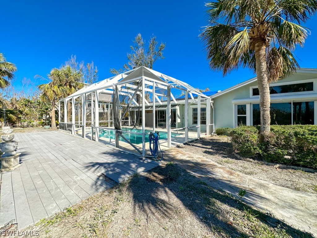 671 Rabbit Road Sanibel, FL 33957 - Photo 41 of 50 a view of a house with a yard and sitting area