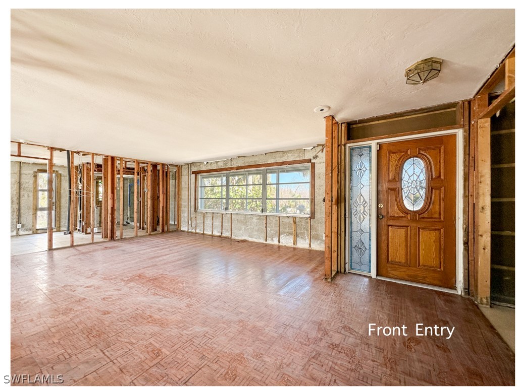 671 Rabbit Road Sanibel, FL 33957 - Photo 5 of 50 a view of an empty room with a window