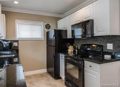 a kitchen with a refrigerator and a stove top oven
