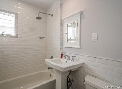 2 Fairfield Road Massapequa, NY 11758 - Photo 7 of 13 a bathroom with a sink a toilet and shower