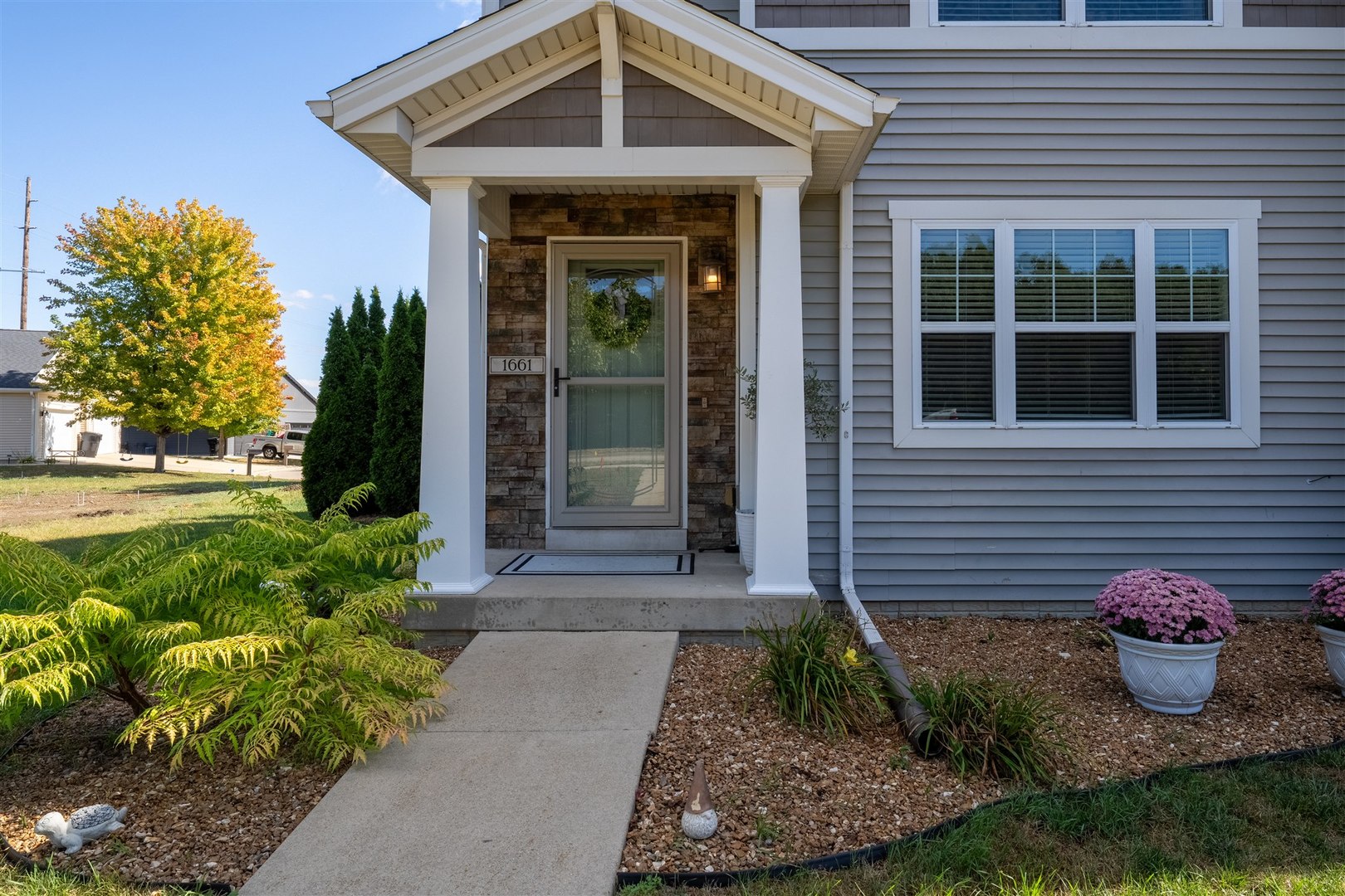 1661 Belclare Road Normal, IL 61761 - Photo 19 of 22 a front view of a house with garden