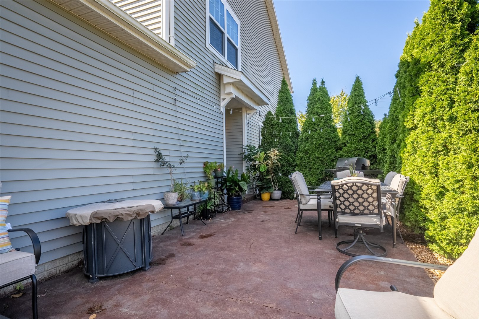 1661 Belclare Road Normal, IL 61761 - Photo 20 of 22 a view of a patio with a chairs and table in a patio