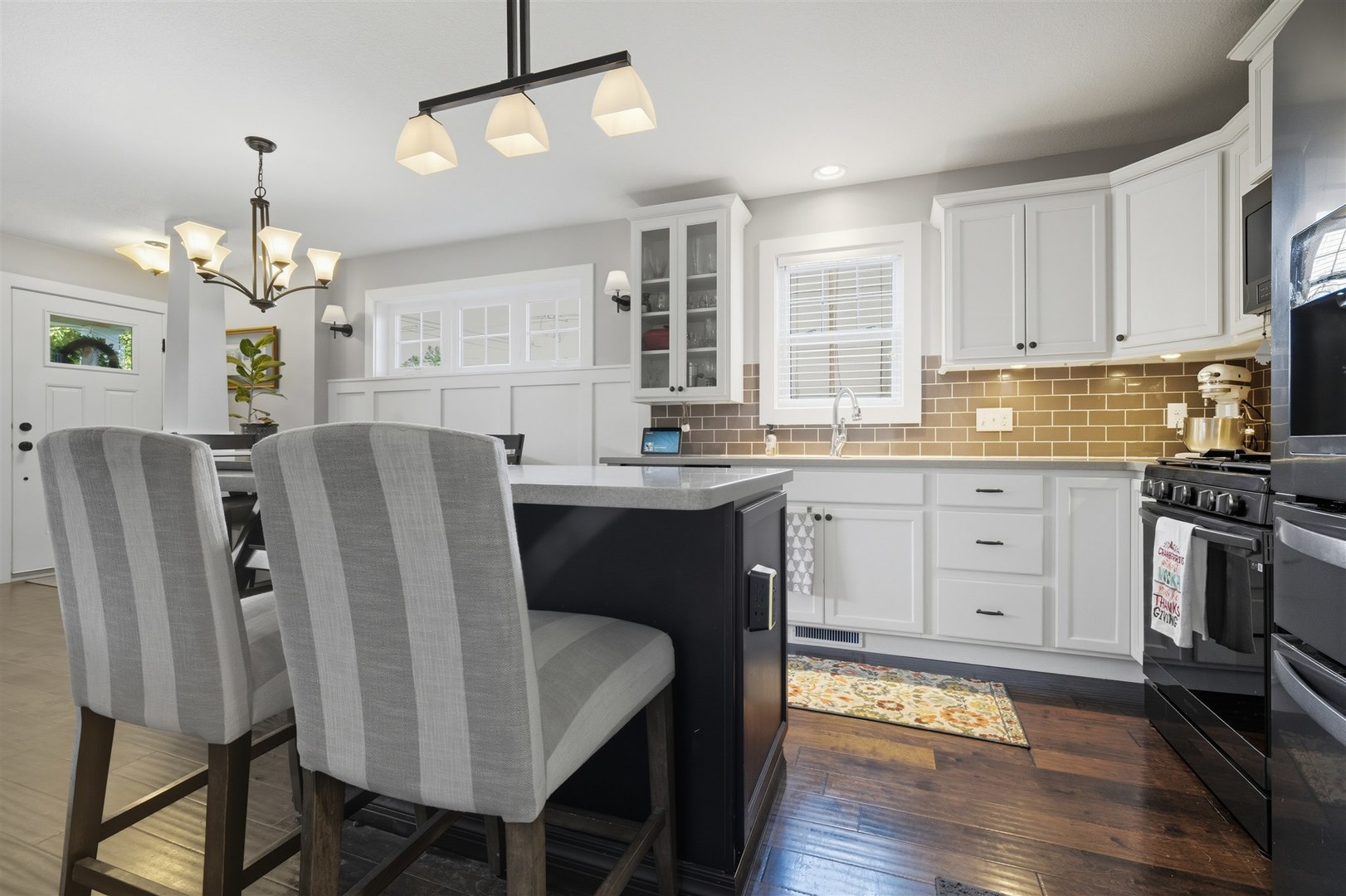 1661 Belclare Road Normal, IL 61761 - Photo 4 of 22 a kitchen with stainless steel appliances granite countertop a dining table chairs refrigerator and cabinets