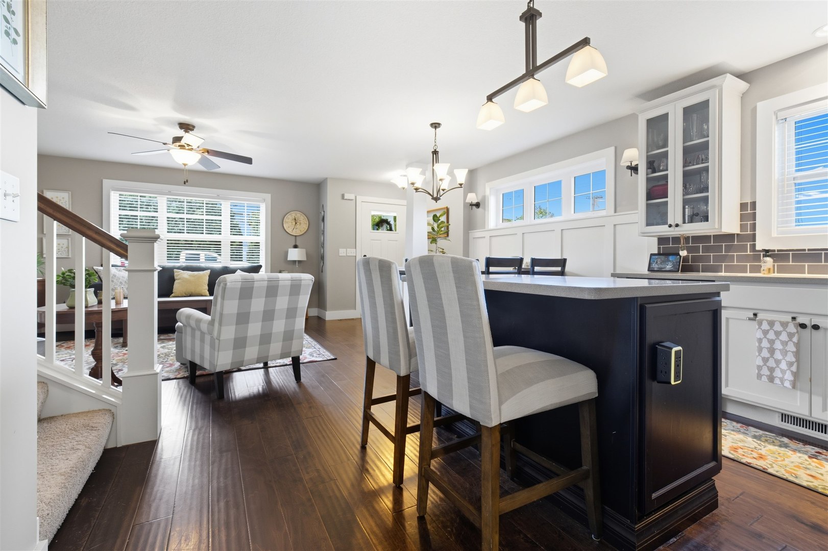 1661 Belclare Road Normal, IL 61761 - Photo 5 of 22 a dining room with wooden floor a chandelier a glass table and chairs
