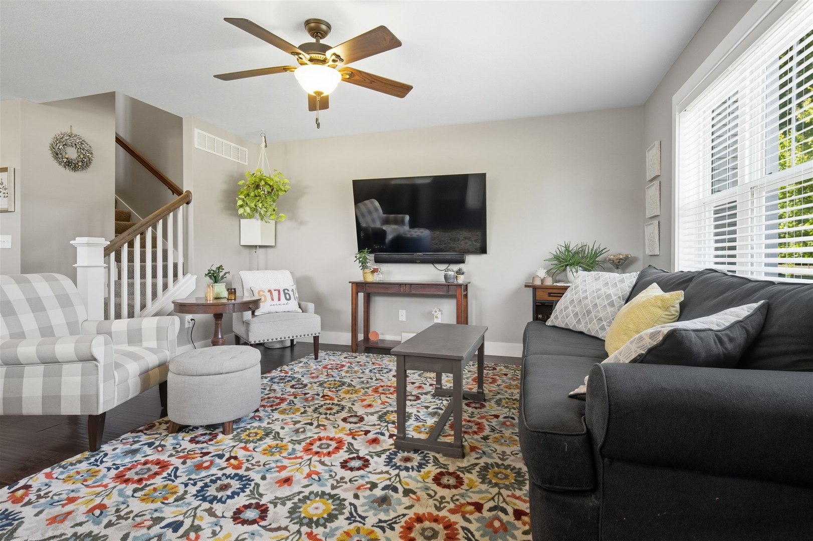 1661 Belclare Road Normal, IL 61761 - Photo 8 of 22 a living room with furniture and a flat screen tv